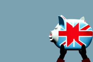 A piggy bank with a british flag in the background